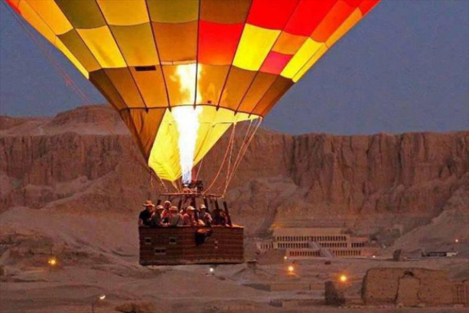 Hot air balloon ride flying over ancient monuments in Luxor Egypt