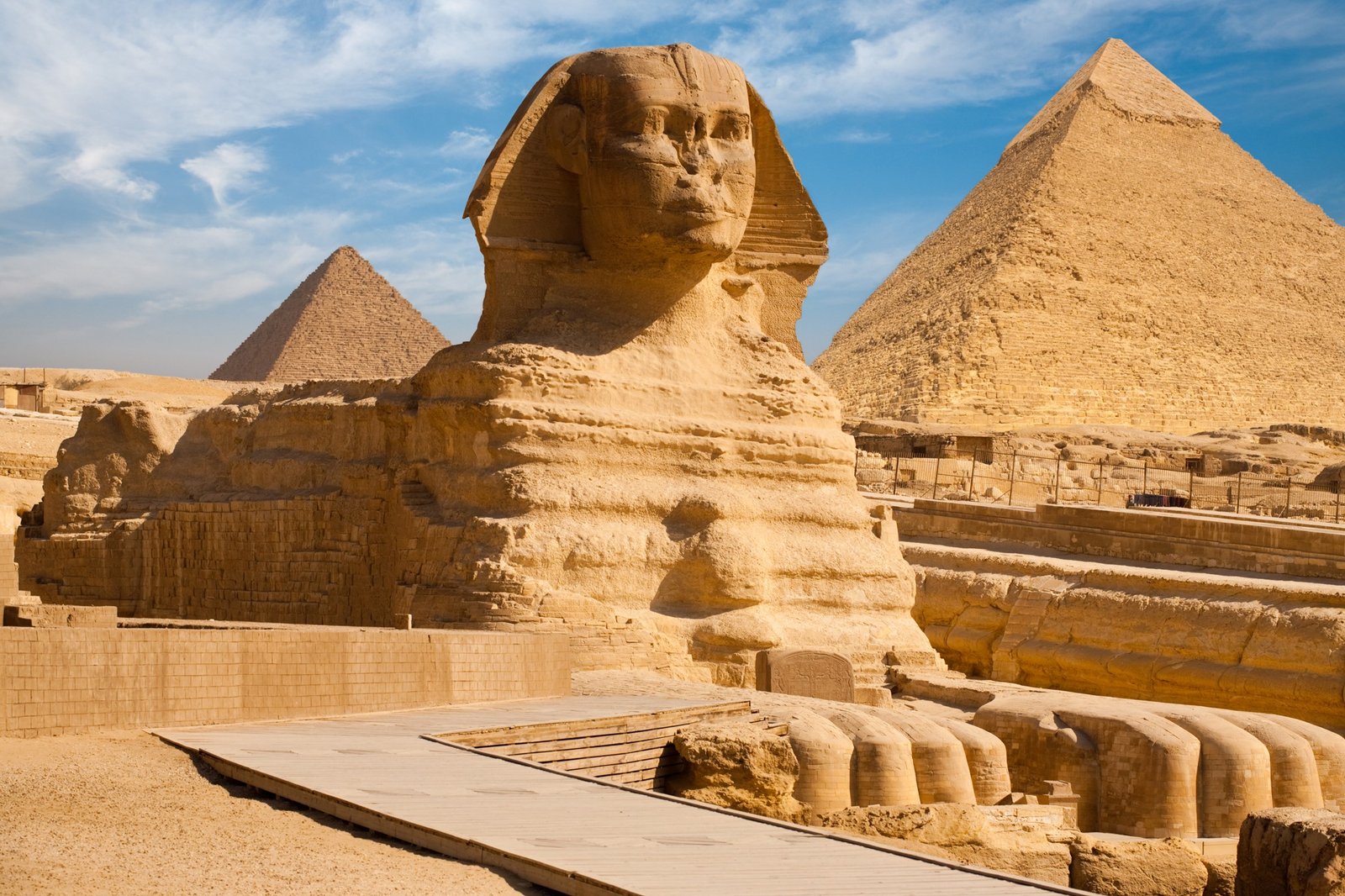 Ancient limestone Great Sphinx in Giza resting before the desert pyramids
