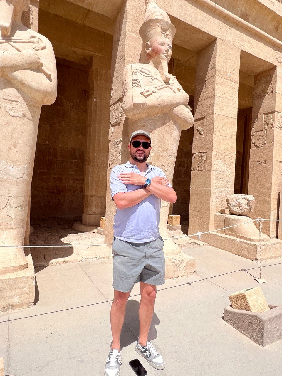 Visitor beside the statues at Hatshepsut Temple in Luxor