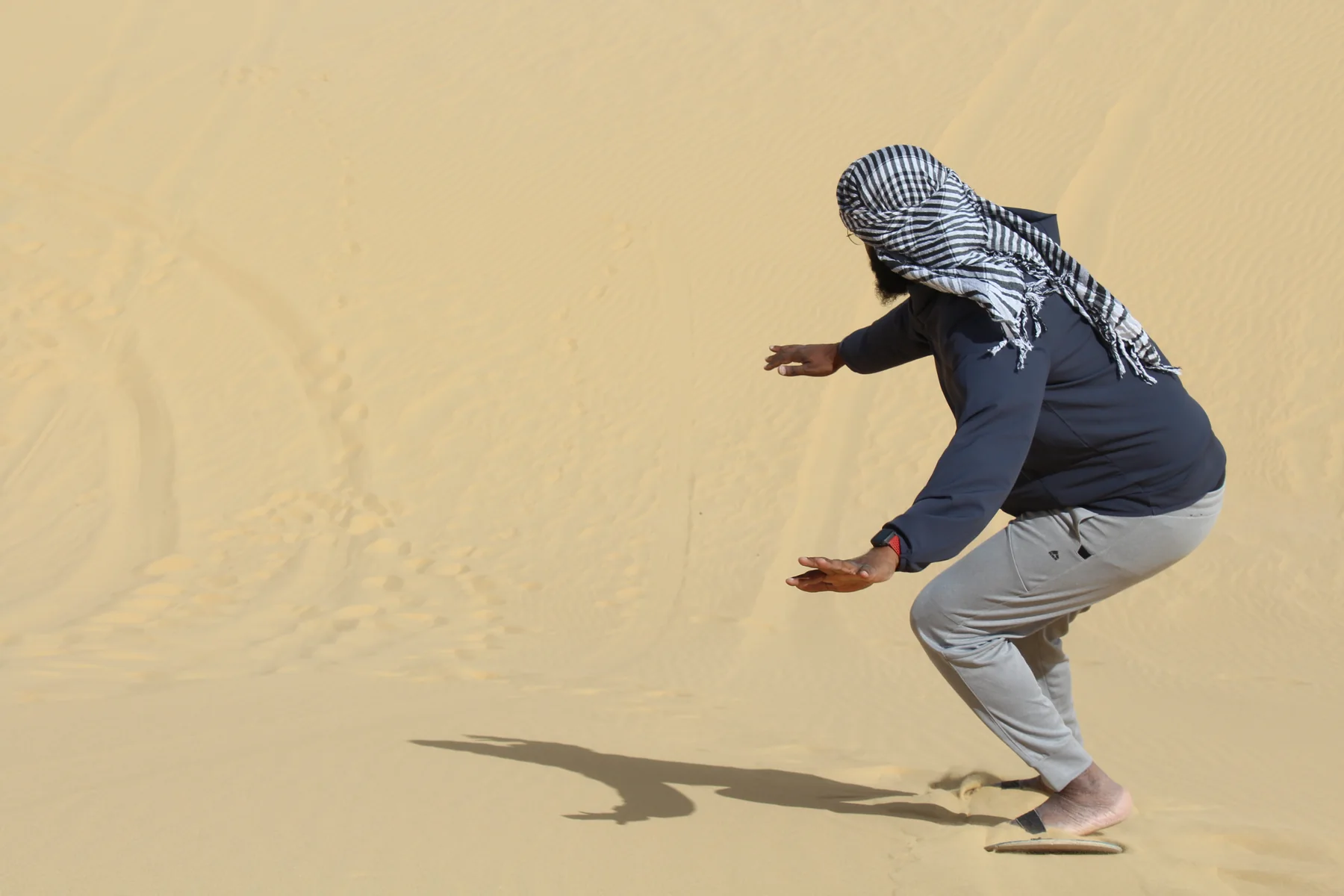 Visitor enjoying the sand dunes on a Fayoum desert safari