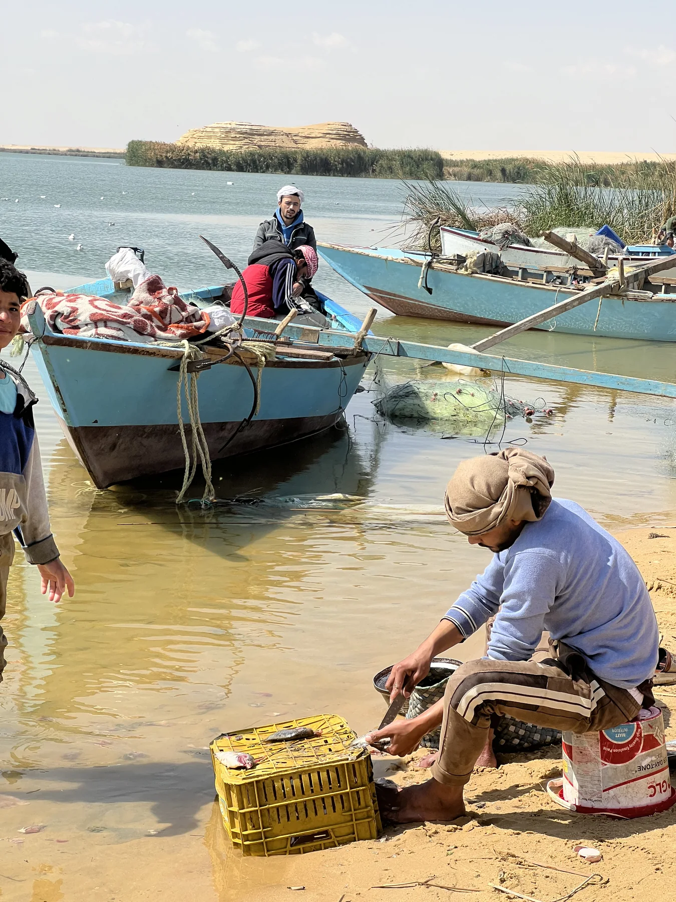 Fishing boats and fishermen on a lake in Fayoum